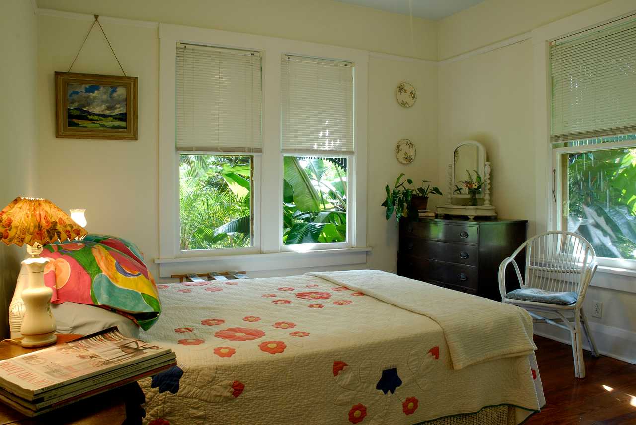 Bedroom and bathroom in a vegetarian, green, eco house with old-fashioned charm.