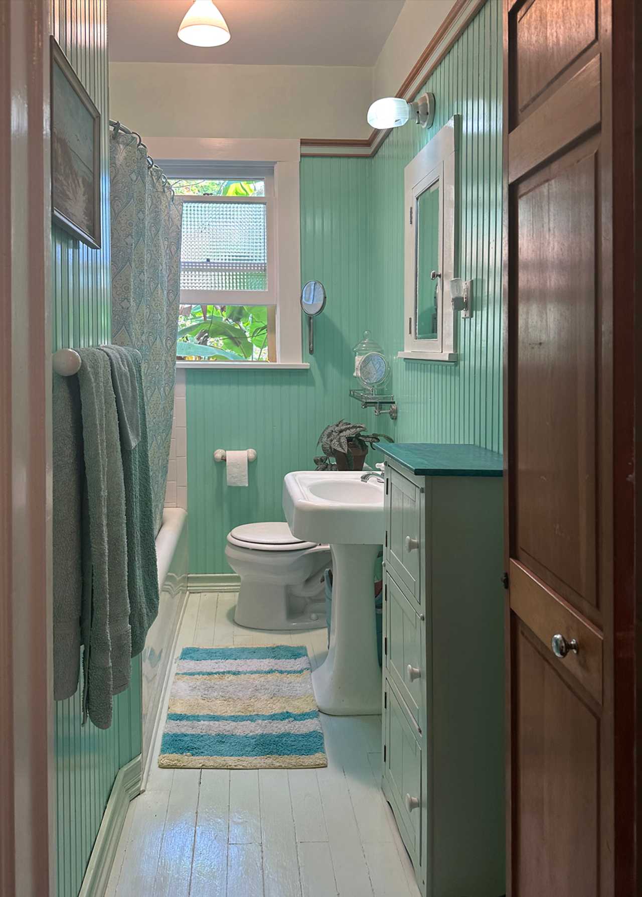 Bedroom and bathroom in a vegetarian, green, eco house with old-fashioned charm.