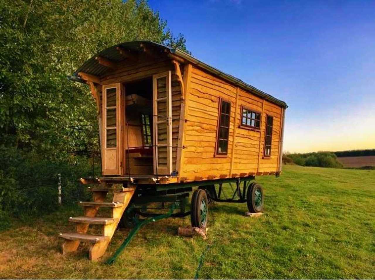 Hand-built wooden showperson's wagon on a veganic forest farm