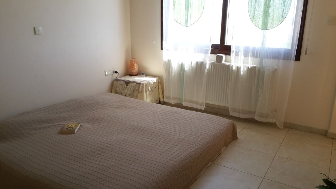 Sunny bedroom with balcony and bathroom