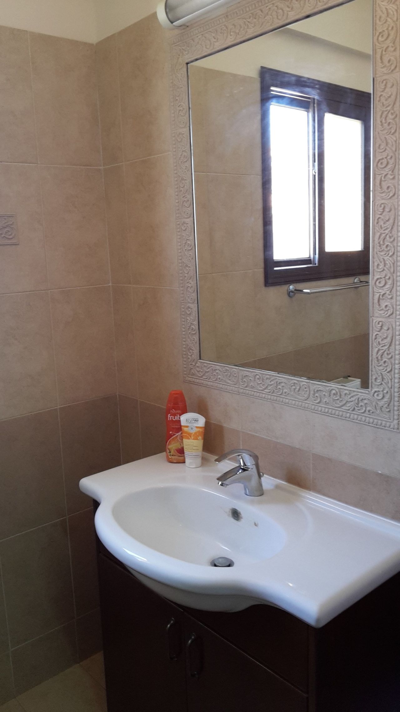 Sunny bedroom with balcony and bathroom